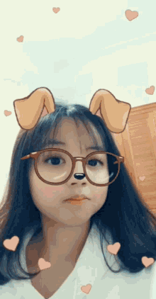 a girl wearing glasses and a dog mask with hearts around her