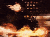 a ghost rider is riding a motorcycle with flames coming out of his head .