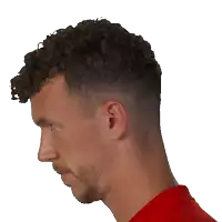 a man with curly hair is wearing a red shirt and has a beard