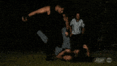 a group of men are standing in a field at night .