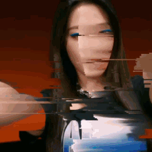 a blurry picture of a woman 's face with a red background