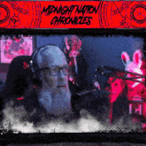a poster for midnight nation chronicles features a man with glasses