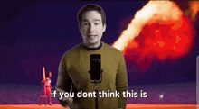 a man is standing in front of a microphone with the words `` if you dont think this is '' written on it .