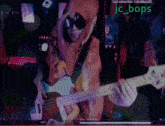a person playing a guitar with the name jc_bops on the bottom right