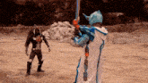 a man in a blue and white costume is holding a sword in a field