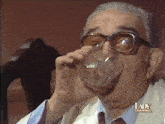 an elderly man drinking from a glass with the lady channel written on the bottom