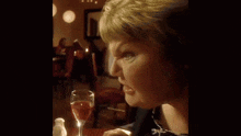 a woman sticking her tongue out at a restaurant