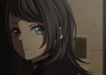 a girl with black hair and blue eyes is looking at the camera