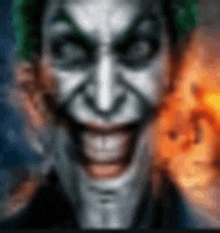 a close up of a man 's face with a joker 's face on it .