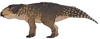 a drawing of a brown and black dinosaur with spots on it