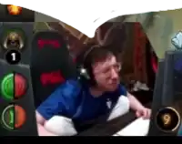 a man wearing headphones is sitting in front of a computer .