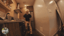 a person standing in a kitchen with the words wsb360 on the bottom