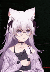 a girl with cat ears holds a black cat in her arms