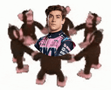 a race car driver is surrounded by stuffed monkeys with the word dew on their arms