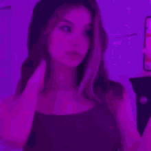 a close up of a purple light coming out of a dark room .