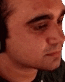 a man is making a funny face with his mouth open .