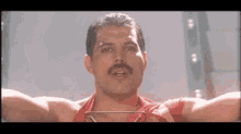 Queen Freddie Mercury GIF - Queen Freddie Mercury Raise GIFs