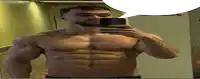 a shirtless man taking a selfie with a speech bubble above him