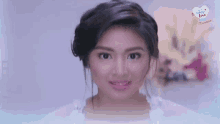 a close up of a woman 's face with the words " i love you " in the background