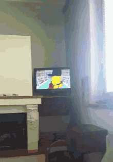 a flat screen tv shows a cartoon of a man boxing