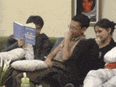 a group of people are sitting on a couch reading a book called you deserve better