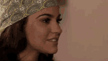 a close up of a woman wearing a bandana