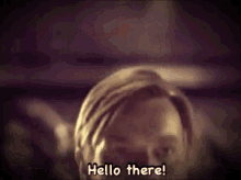 a close up of a man 's face says hello there