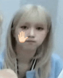 a girl with a hand on her face