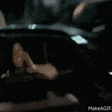 a gif of a man eating a piece of food with the words makeagif below him