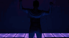 a silhouette of a man in a blue shirt