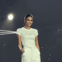 a woman wearing a white t-shirt that says miss leningrad