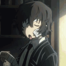 a person with a bandage on their face is licking their lips