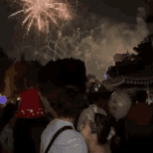 a blurry picture of a crowd of people looking up at the sun
