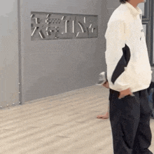 a man standing in front of a sign that says ' king ' on it