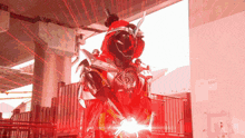 a red light is shining on a person in a red and black outfit