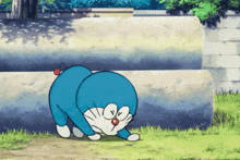 a cartoon character named doraemon is crawling in the grass near some pipes