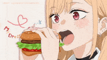 a drawing of a girl eating a hamburger with a heart drawn on the wall
