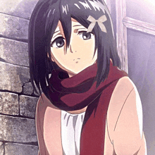 a girl with a red scarf around her neck has a bow on her head
