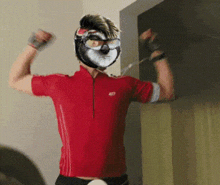 a man in a red shirt has a mask on his face