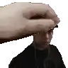 a hand is holding a man 's head in a pixel art image .