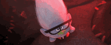 a cartoon troll with glasses and a green tongue sticking out