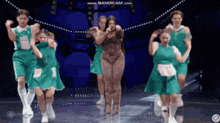 a group of people are dancing on a stage with the words www.bandicam.com in the upper right corner