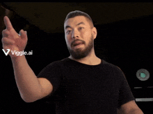 a man with a beard is pointing at something with a viggle.ai logo in the corner