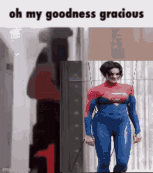 a woman in a superhero costume is walking down a street .