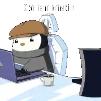 a penguin wearing a hat is sitting at a desk with a laptop and a cup of coffee