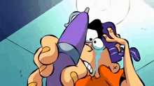 a cartoon character is crying while holding a glue gun .