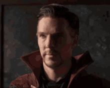 a man with a beard wearing a red jacket
