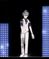 a man in a suit is dancing on a stage in front of a blue light .