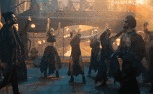 a group of people are dancing in front of a sign that says avantika