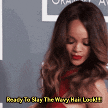 a woman in a red dress says " ready to slay the wavy hair look !!! "